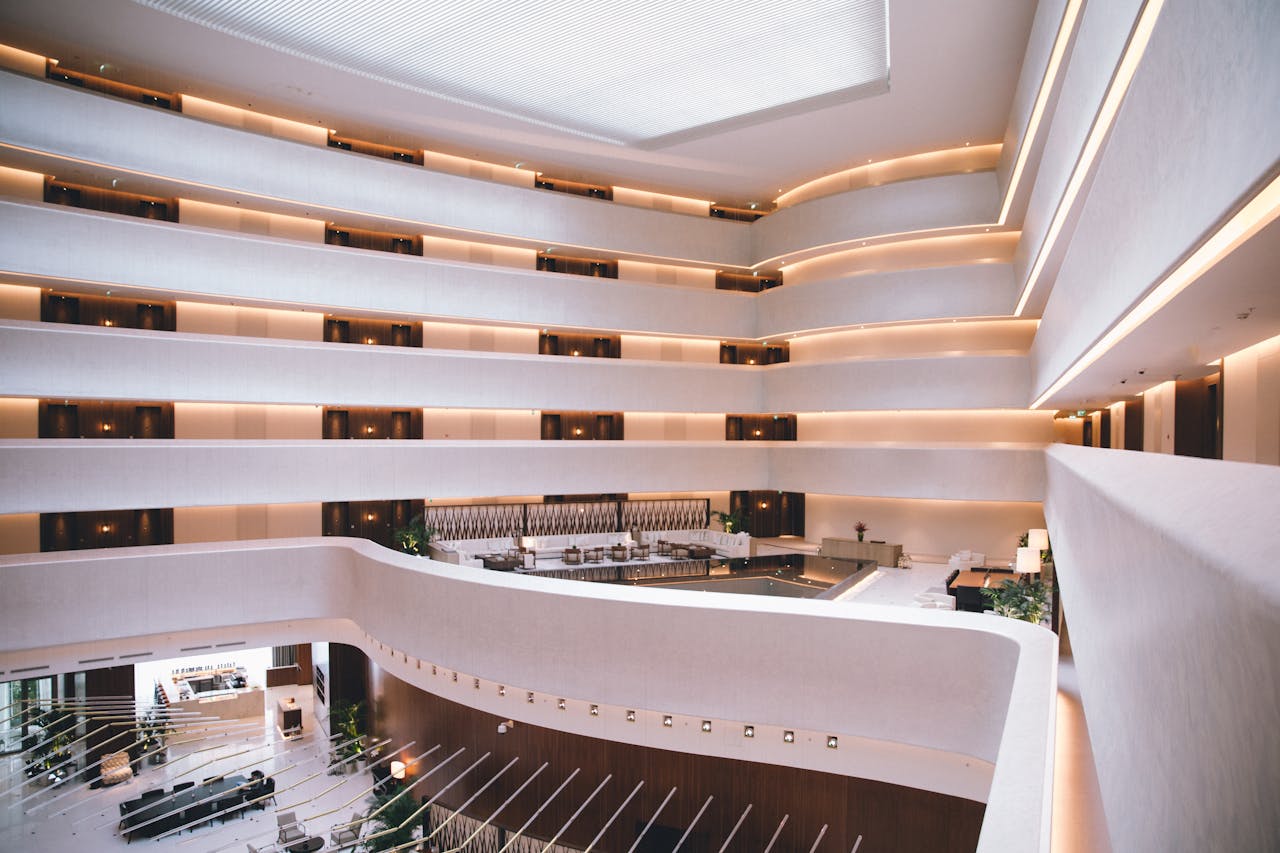 Spacious modern hotel atrium with sophisticated design and ambient lighting.